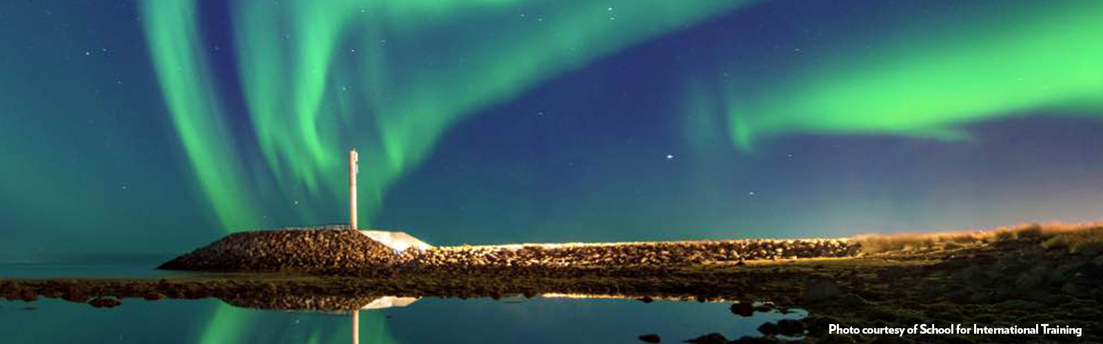 The Northern Lights reflecting off a body of water. 